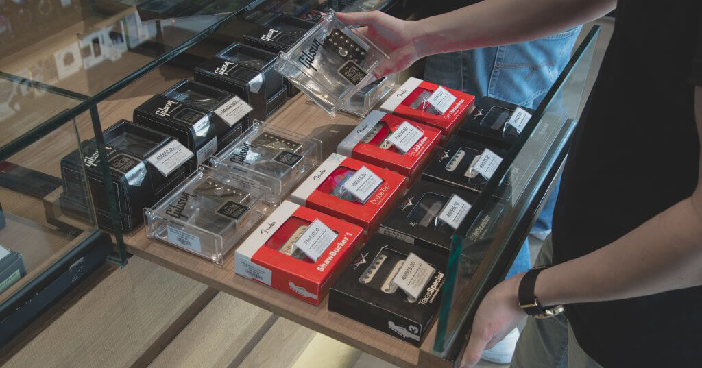 Guitar pickups in a display drawer in a music shop in Bangsar, Malaysia