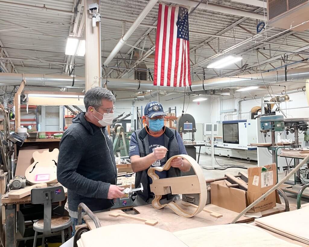 Heritage Guitars luthiers work on a semi-hollow guitar in Kalamazoo, Michigan!