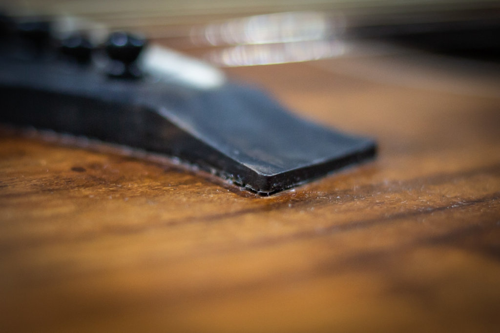 lifting bridge on an acoustic guitar