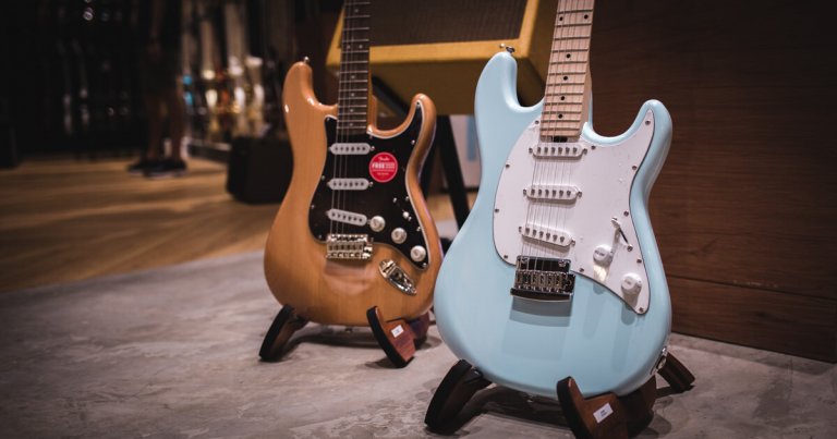 Two beginner guitars in a music store in Asia