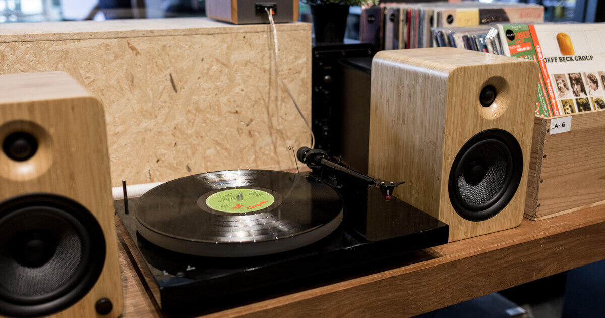 Vinyl Turntable and Audio Speakers in A Music Store